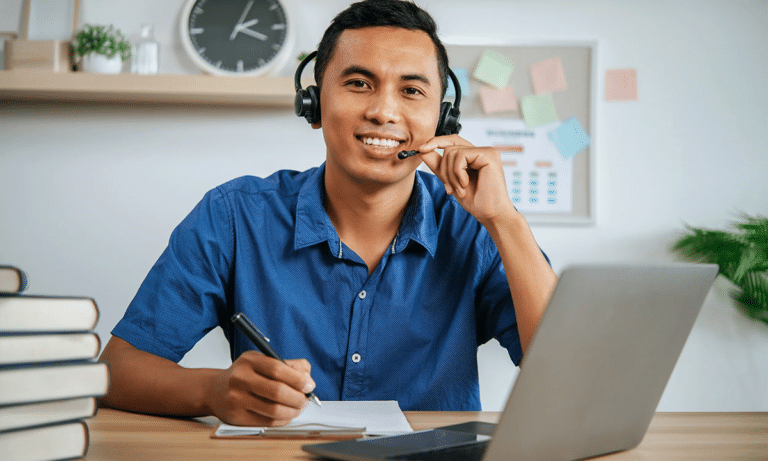 businessman-wearing-headset-talking-to-caller-in-busy-customer-services-centre-philippines